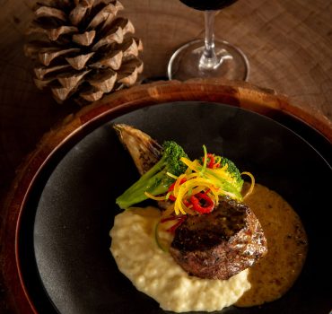 Gourmet steak dinner with wine at Arathusa Safari Lodge