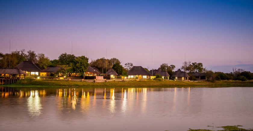 thatch-roof-houses-next-to-a-dam